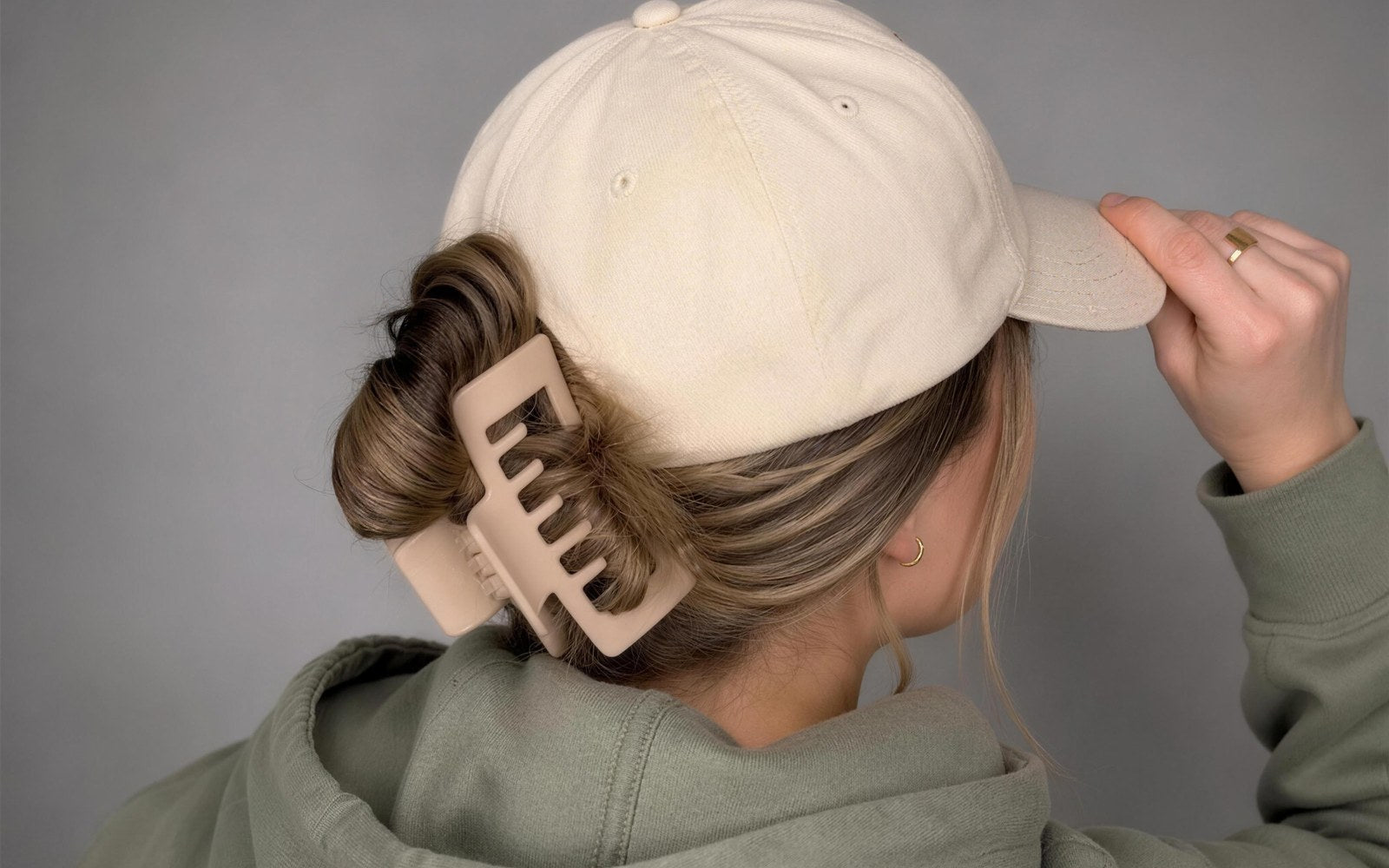 Alora hat claw clips holding a cap in place