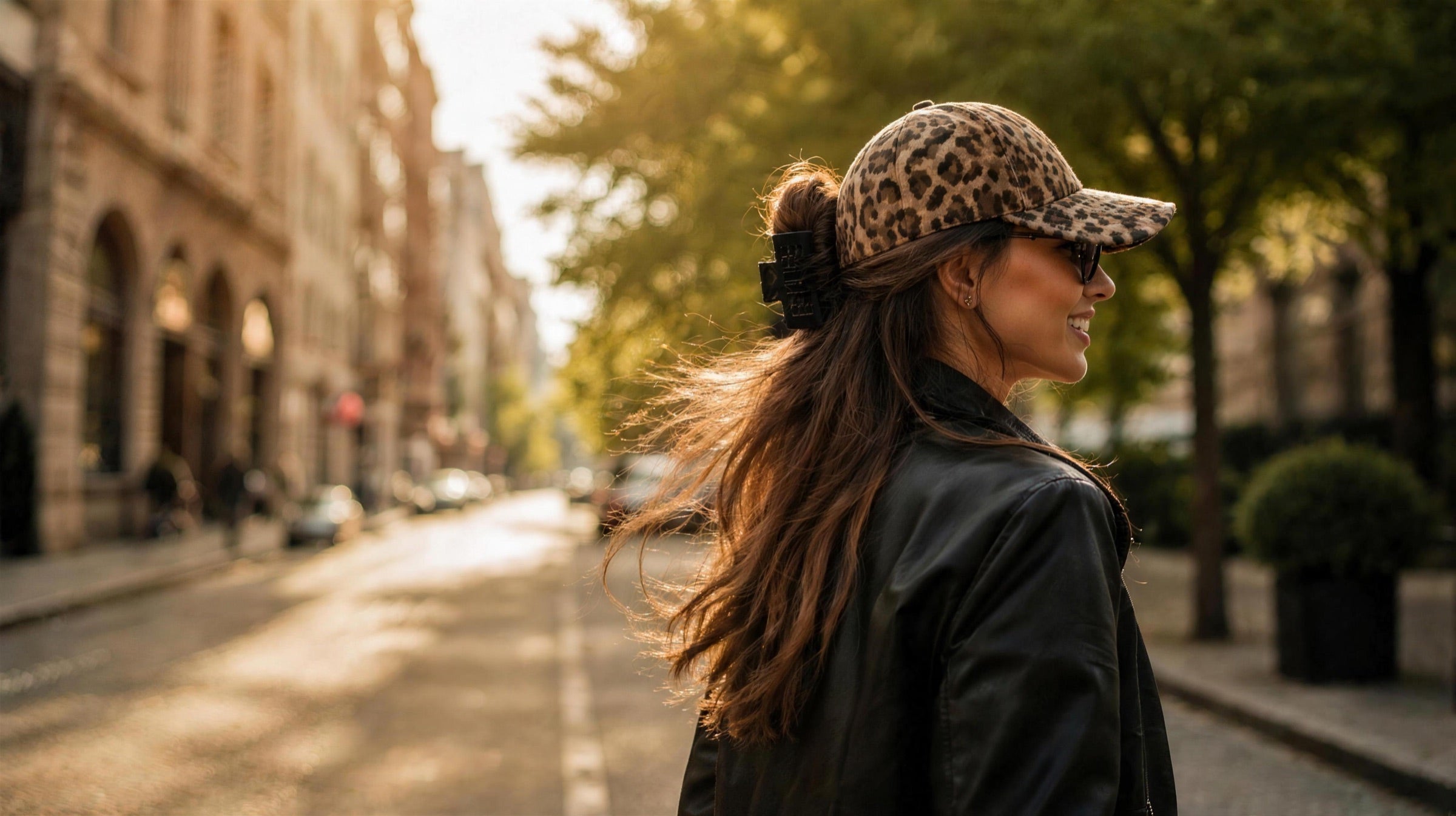 Model wearing the Alora leopard-print hat claw clips